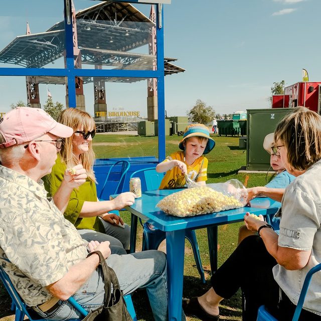 Friends sharing popcorn at Gourd Days