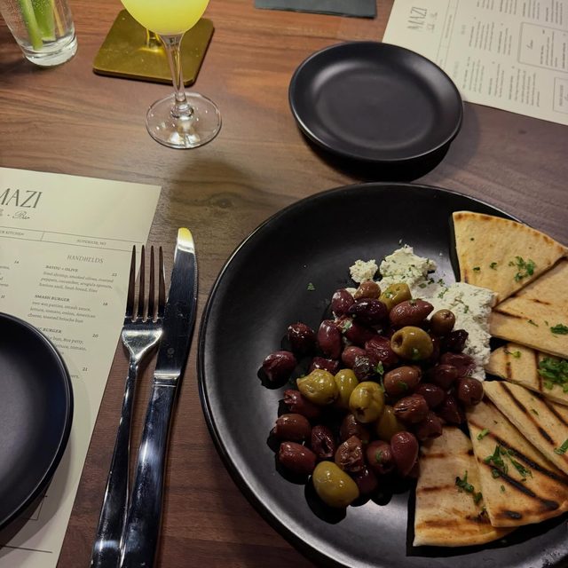 Olives and grilled pita at MAZI in Superior