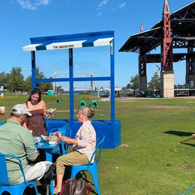 Family at the Birdhouse concession on the lawn