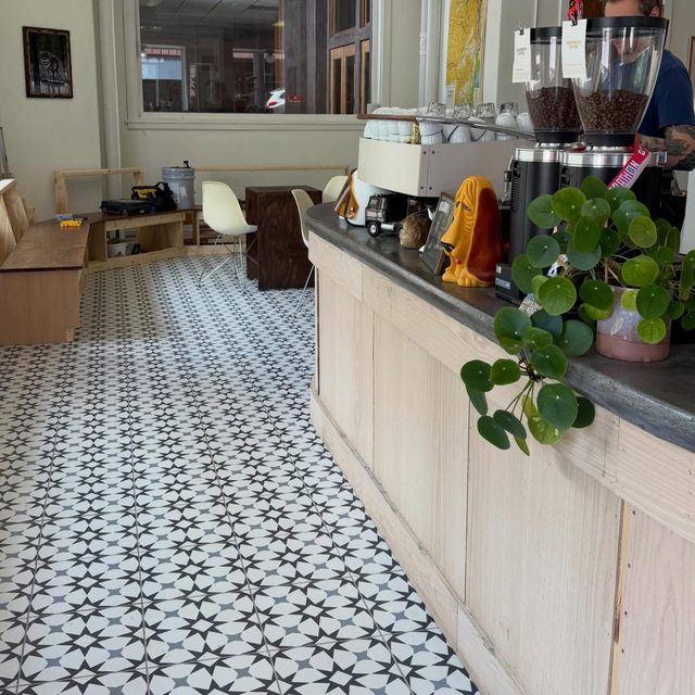 Local coffee shop interior with patterned tile floor