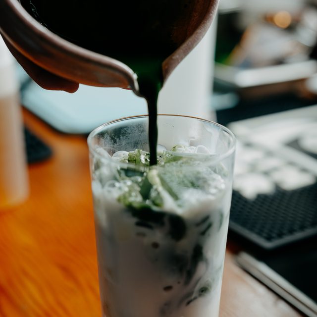 Matcha being poured over ice
