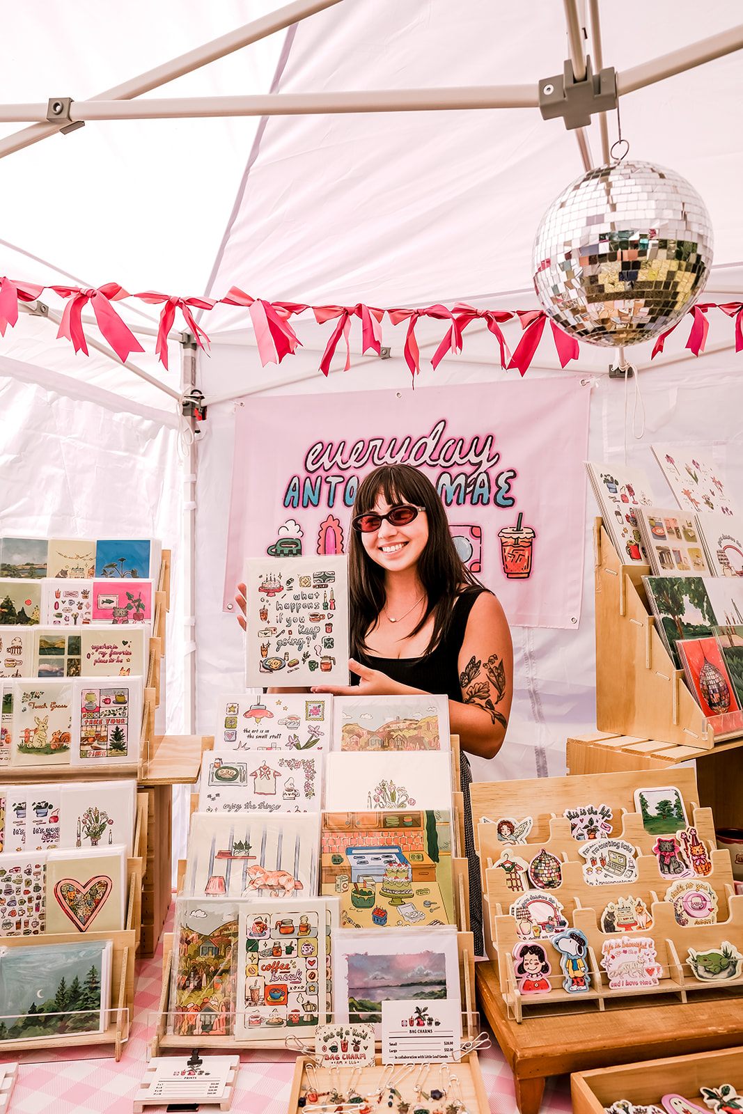 A maker's booth of prints and stickers at Flock Art Fest