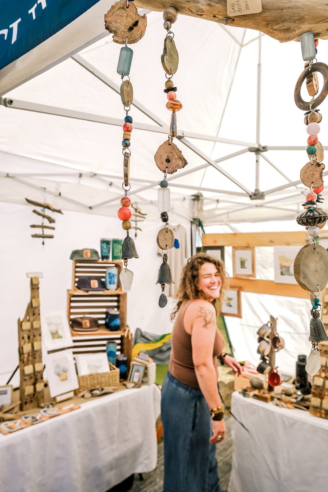 Driftwood and beach-glass wind chimes at a Flock Art Fest booth