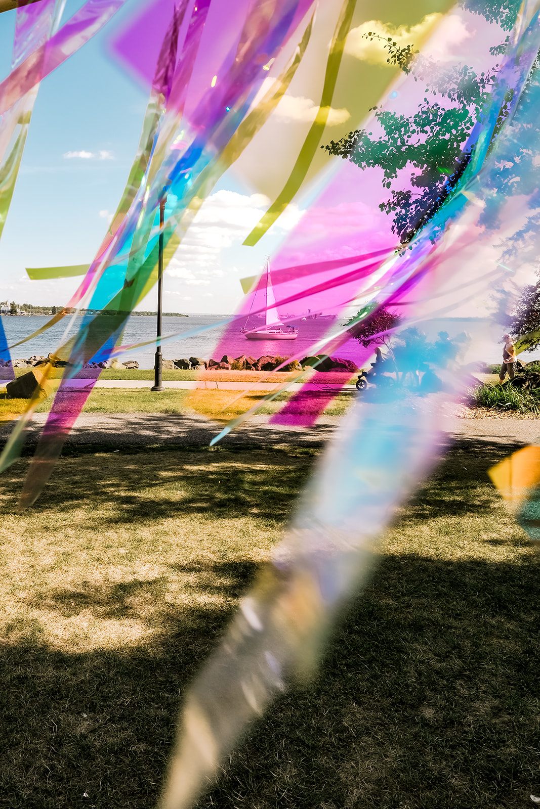 Iridescent streamers framing a sailboat on Lake Superior